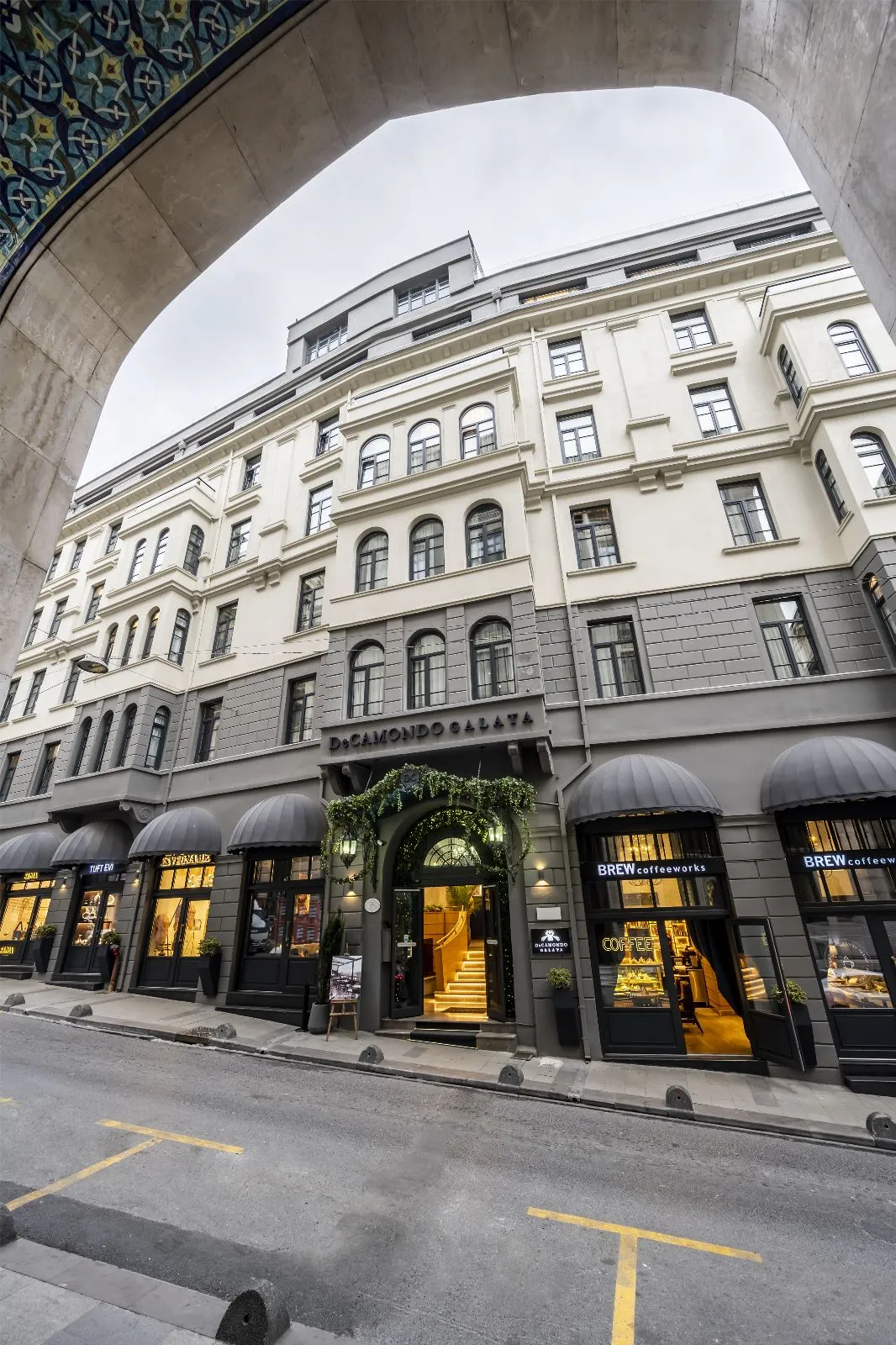 The Banque Building of DeCamondo Galata seen through an arched gateway