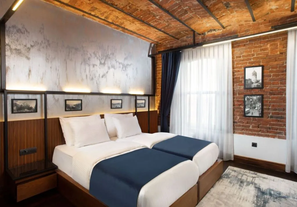 House Building twin room with exposed brick