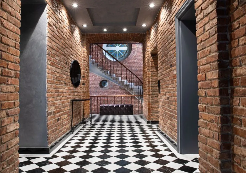 Brick corridor and spiral staircase in the House Building