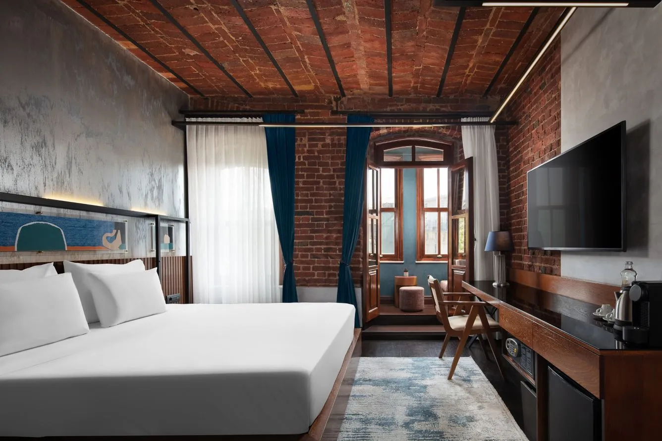 Galata House Deluxe room with a King bed and a vaulted brick ceiling