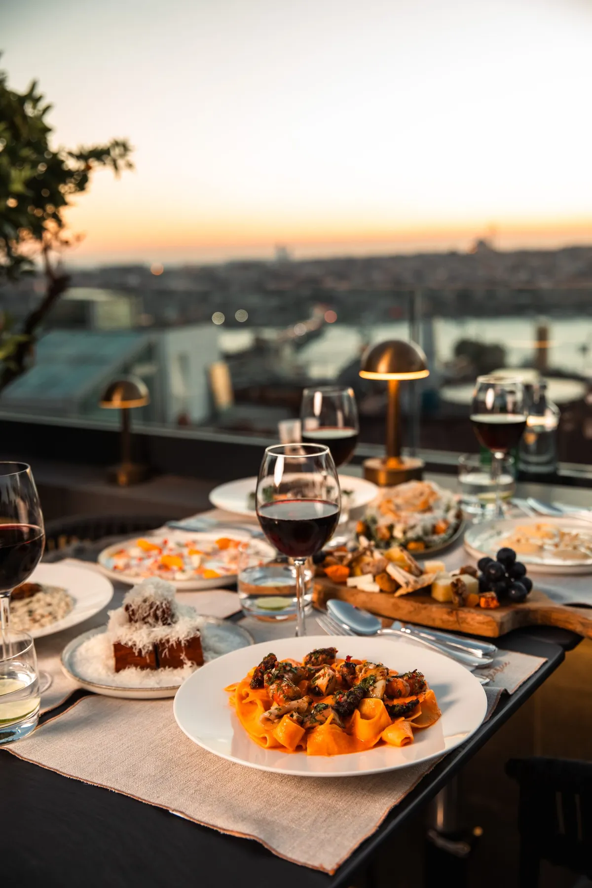 Table set for sharing with the city skyline behind
