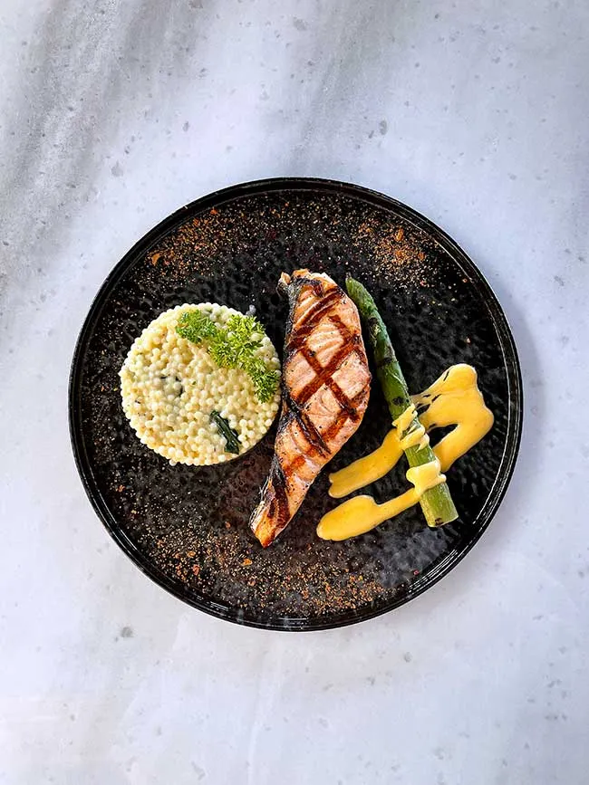Grilled salmon smoked with hazelnut shells
