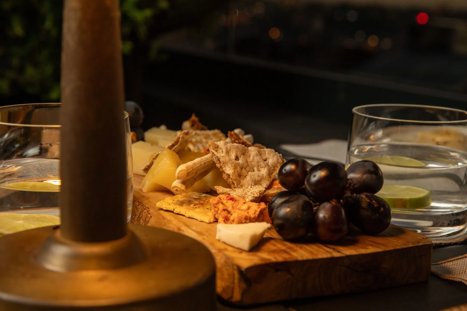 Cheese board and grapes on the terrace