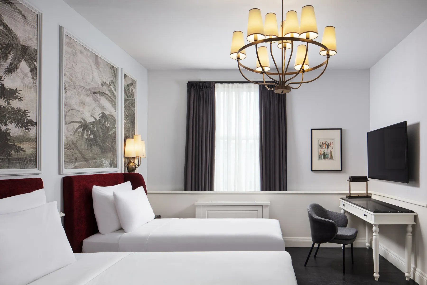 Twin room with two beds and a desk