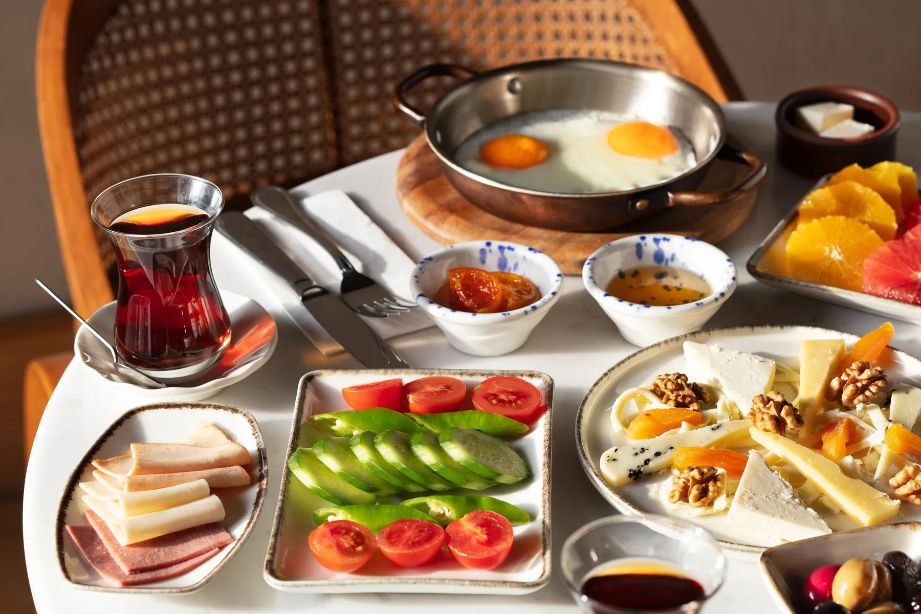 Turkish breakfast with eggs, cheeses and tea