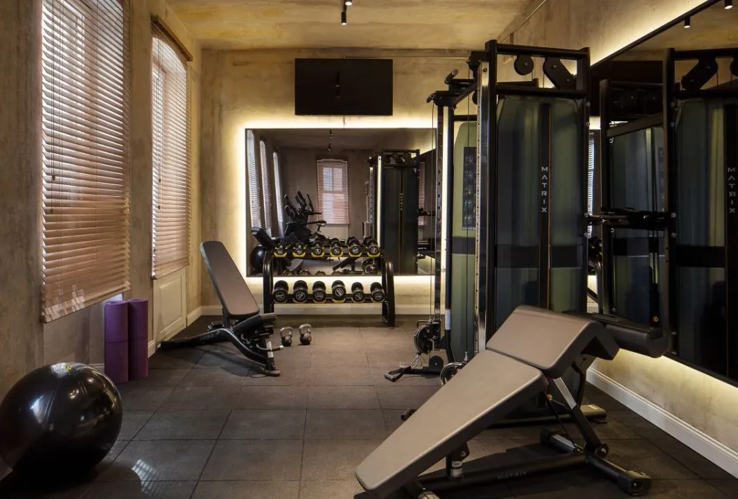 Gym with a multi-station machine and bench